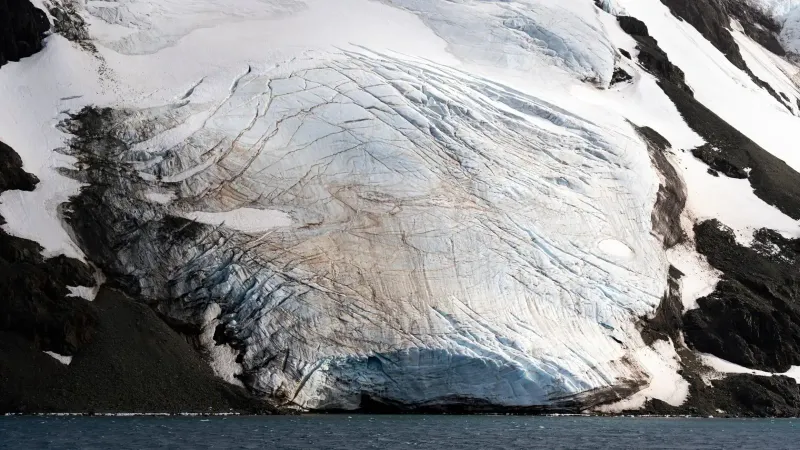 A breathtaking view of a glacier meeting the sea, showcasing natural beauty.