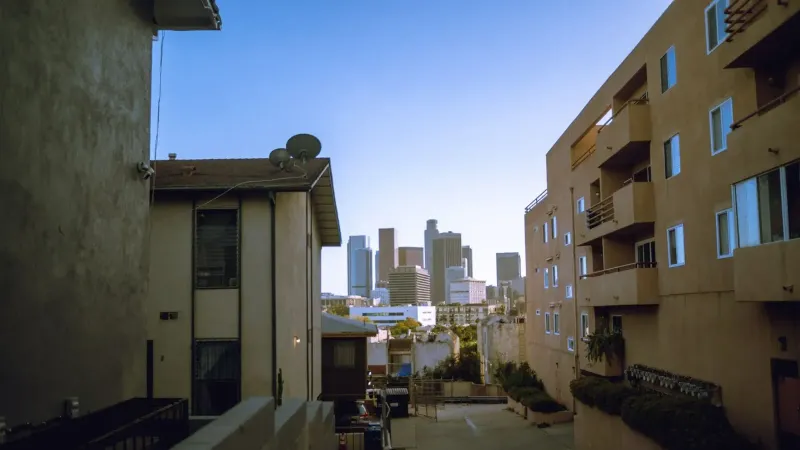 View of downtown skyscrapers from residential area, perfect for urban lifestyle themes.