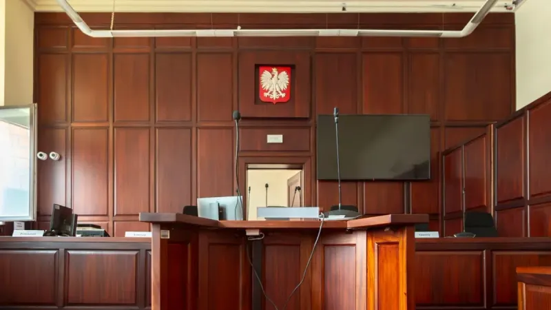 Elegant wooden interior of a courtroom in Wrocław, showcasing judicial decor.