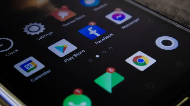 Detailed view of a smartphone screen with popular app icons including Facebook and Messenger.