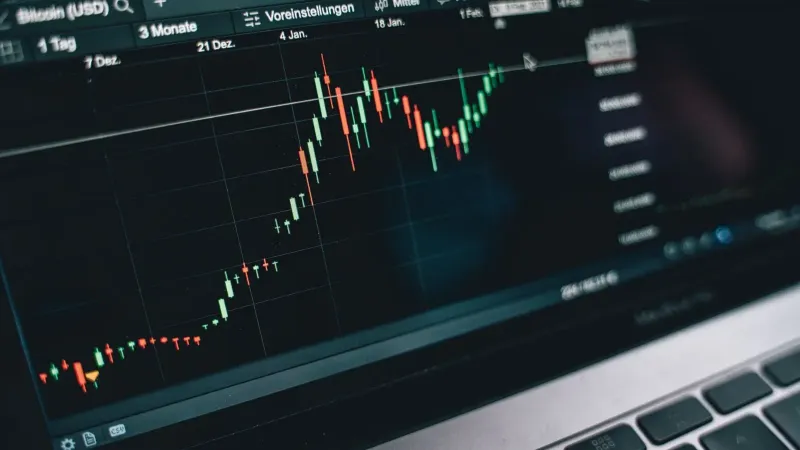 Close-up of a computer screen displaying cryptocurrency market trends and data.