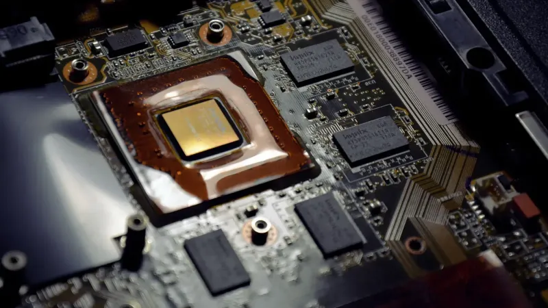 Detailed view of computer processor on motherboard with visible components and circuits.