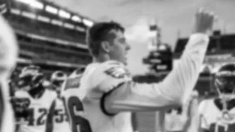 QB Tanner McKee talking to his teammates pregame