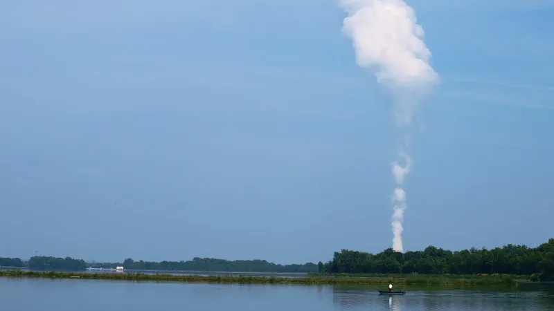 Isar Nuclear Power Plant from across lake showing cooling tower plume