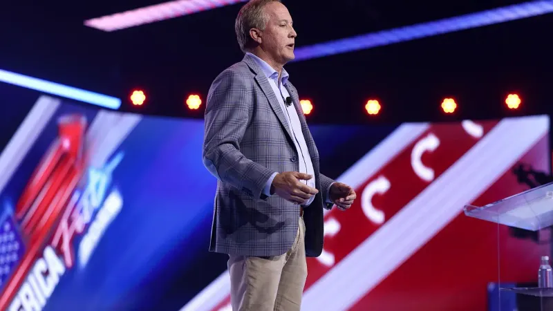 Texas Attorney General Ken Paxton speaking with attendees at the 2025 AmericaFest at the Phoenix Convention Center in Phoenix, Arizona.