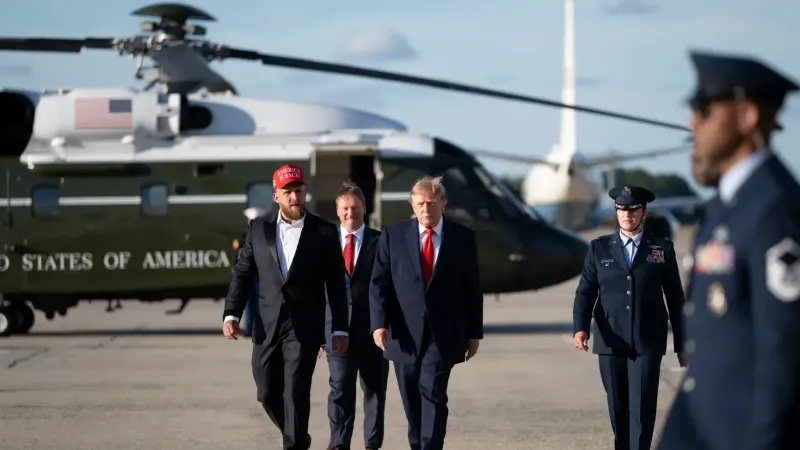 President Donald J. Trump disembarks Marine One at Joint Base Andrews, Maryland on Monday, October 12, 2026, with Jake Paul and boards Air Force One en route Youngstown, Ohio. (Official